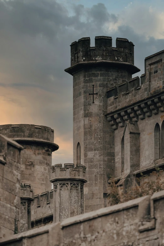 a view of a castle wall with two towers