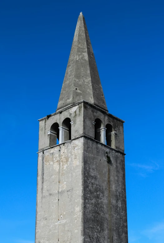 a very tall, old building with several windows