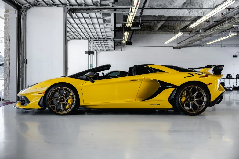 a yellow and black car is parked in a garage