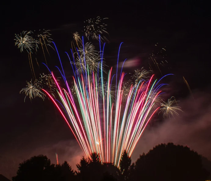 fireworks are lit up on the night sky