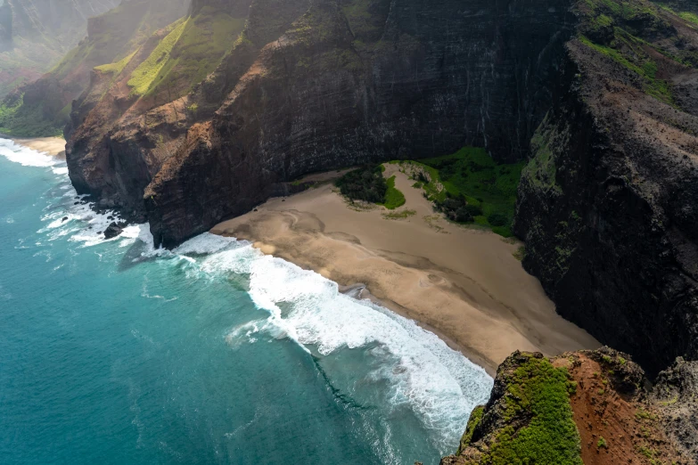 a scenic view from above the cliffs at a sandy beach