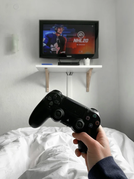 someone using a remote to play a video game