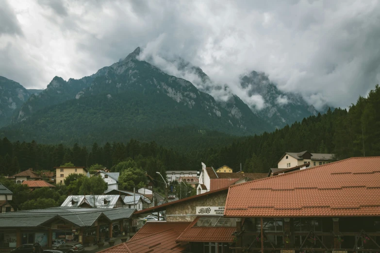 view from the roof of an older building of a village and mountains