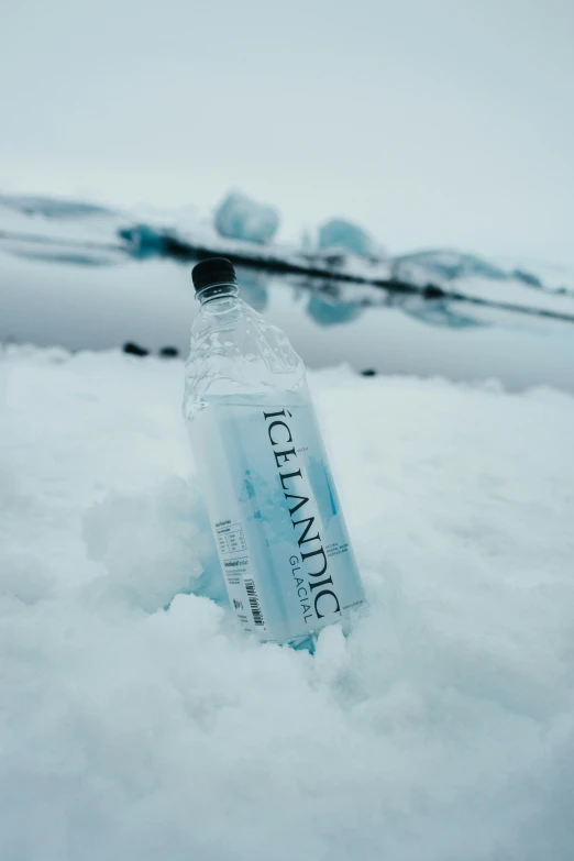 a bottle with a message sitting in the snow