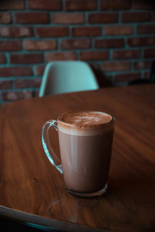 a coffee cup sitting on top of a wooden table