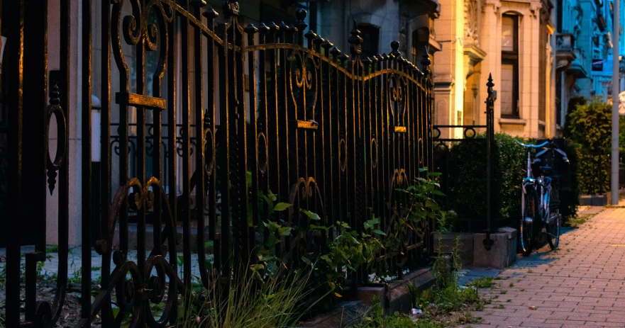 a building that has many iron fences next to it