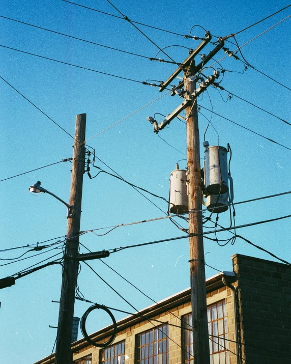 there are some power poles, some telephone wires and buildings