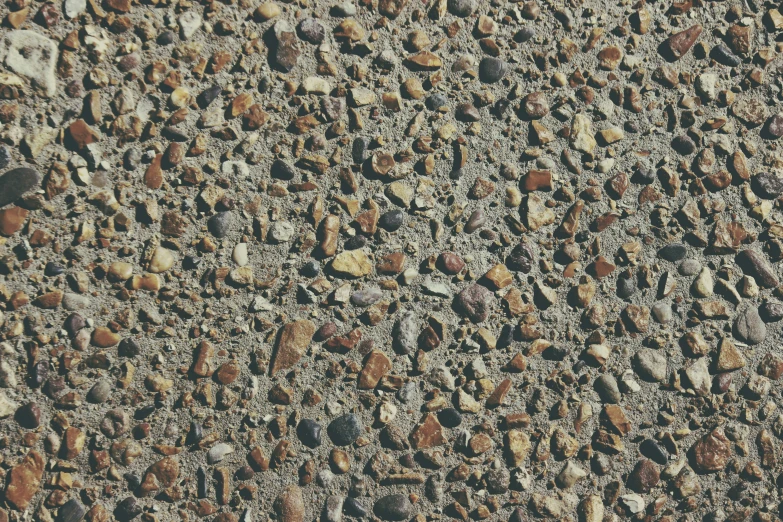 a wall with some rocks on it and one in the center