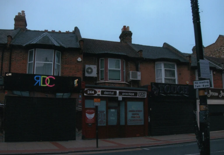 two businesses sitting on the corner of a street