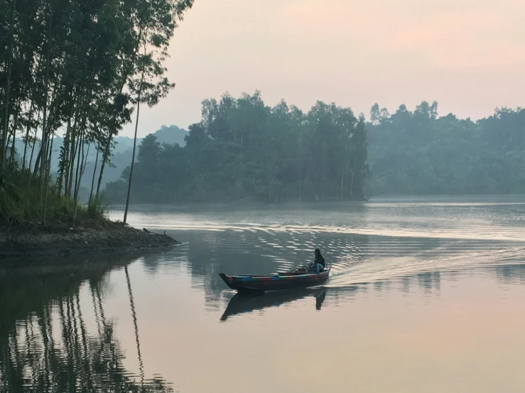 there is an empty boat floating on the water