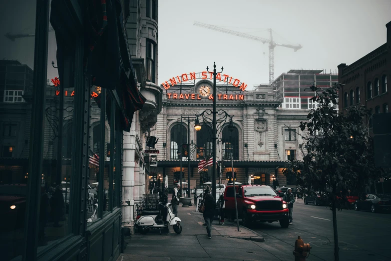 a city street with the lights on the top of a clock