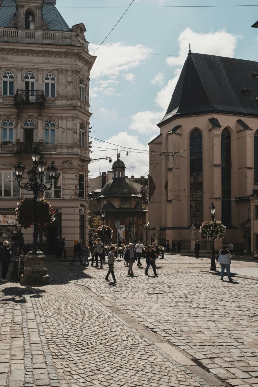 people on brick streets in a european european country