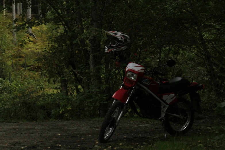 a motorcycle that is parked in the dirt