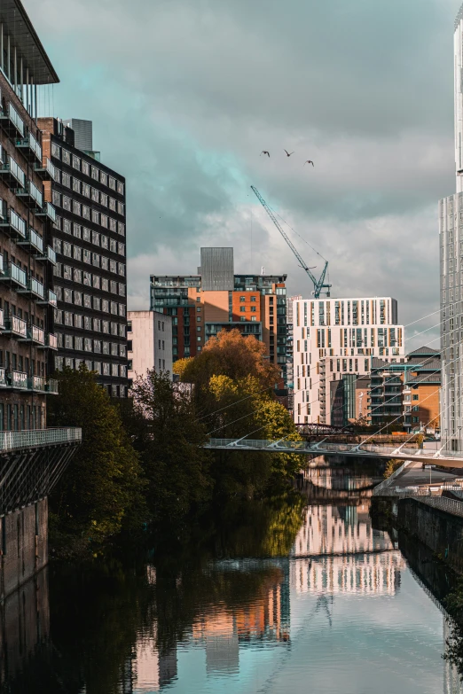 the city of london is reflected on a calm river