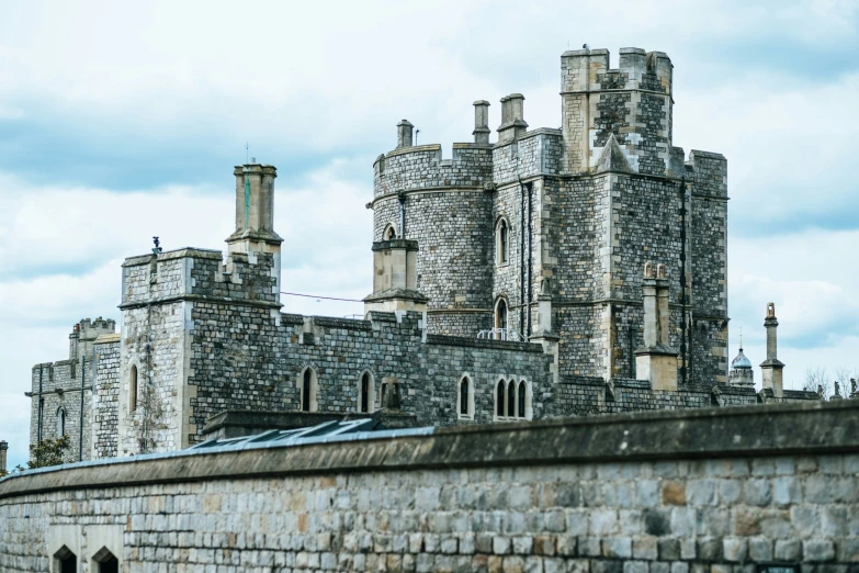 a building with turrets is made of stone