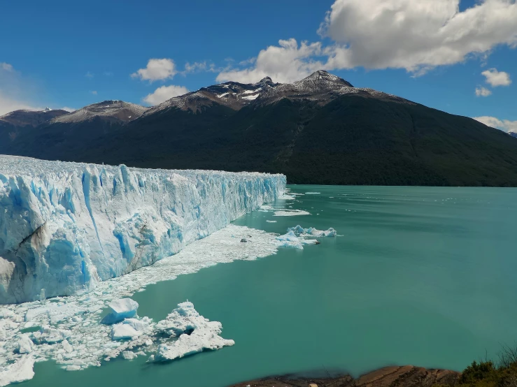 a beautiful view of an icy blue glacier