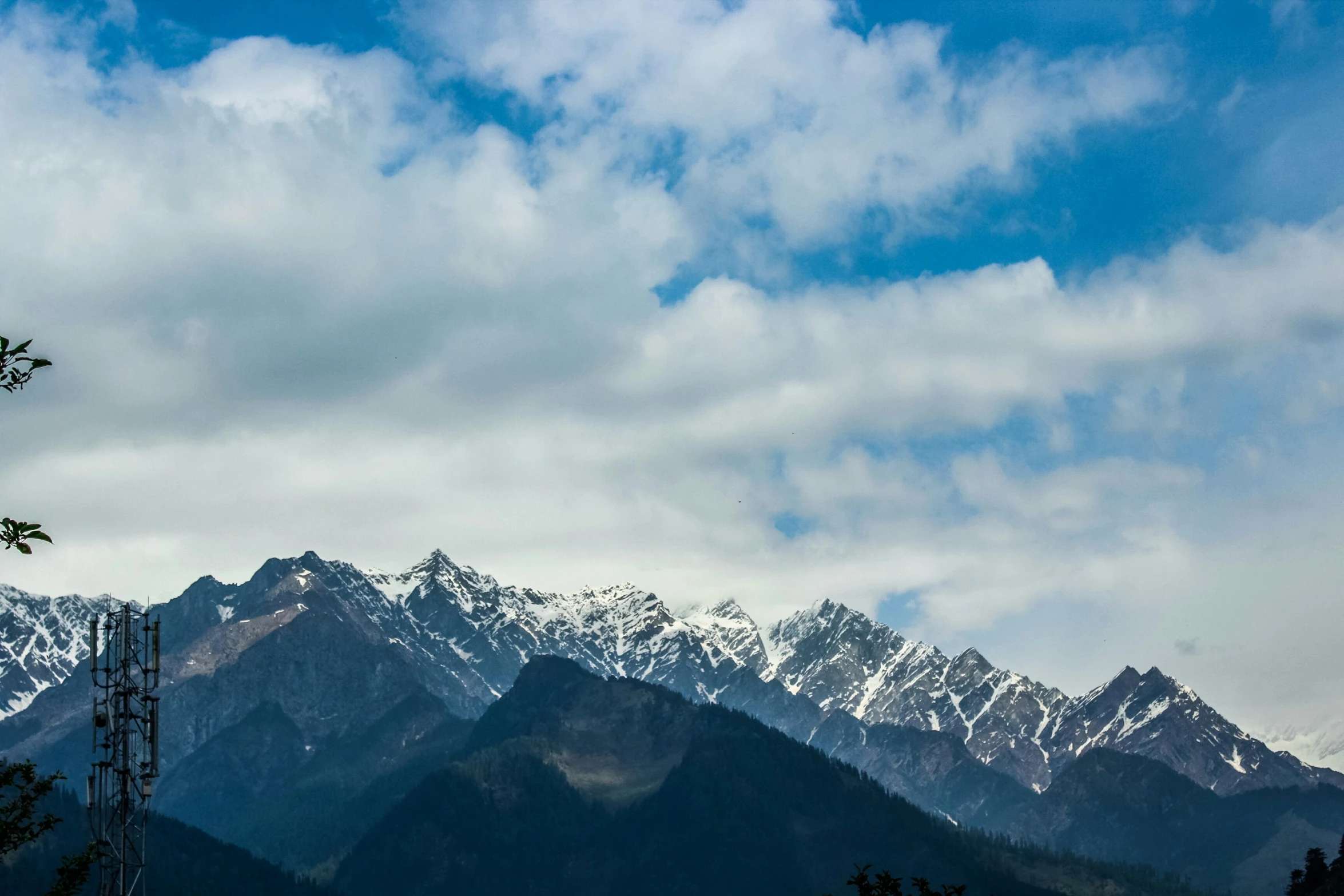 a scenic mountain scene is seen against the sky