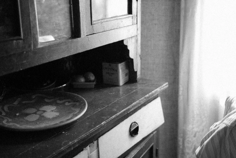 the interior of a kitchen with dark colors