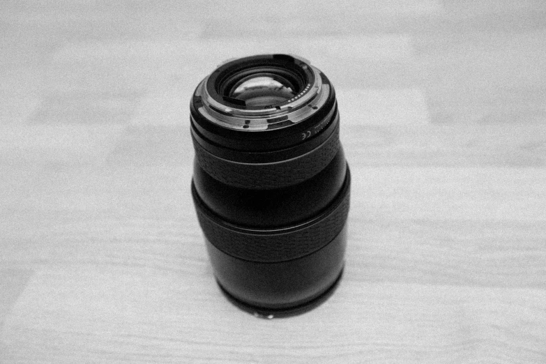 black and white pograph of a camera lens