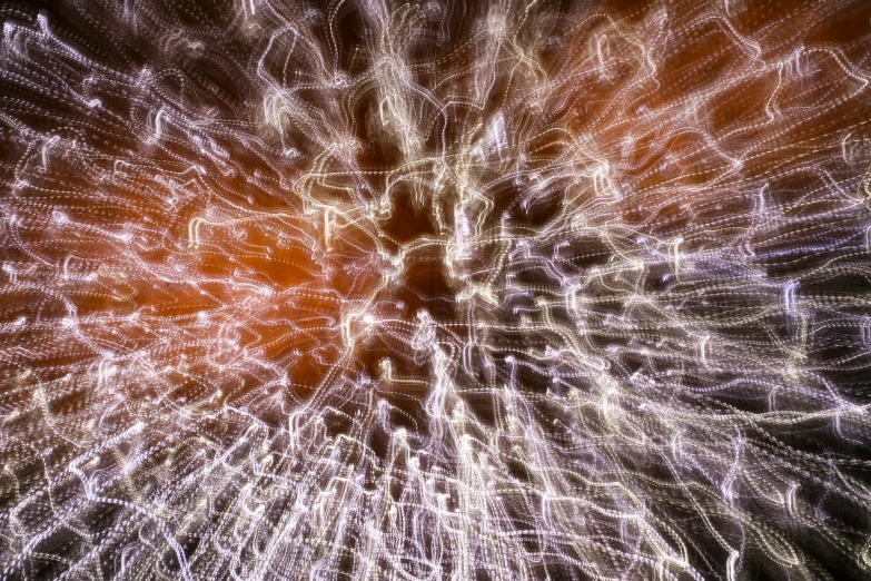 a bright fireworks is shown in the dark sky