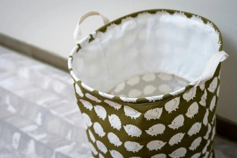 a small round canister sits on top of a rug