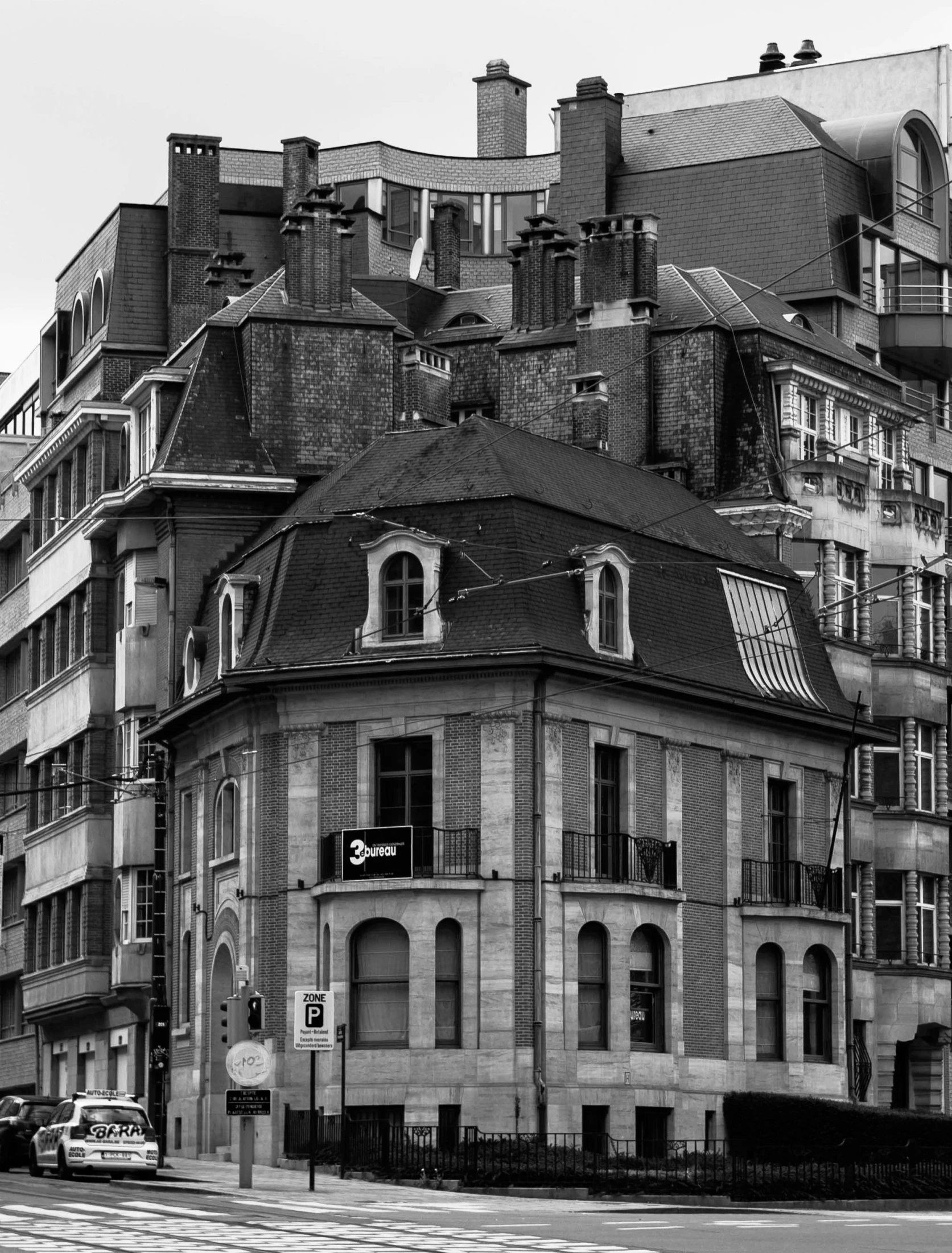 this black and white image shows the building's roof tops