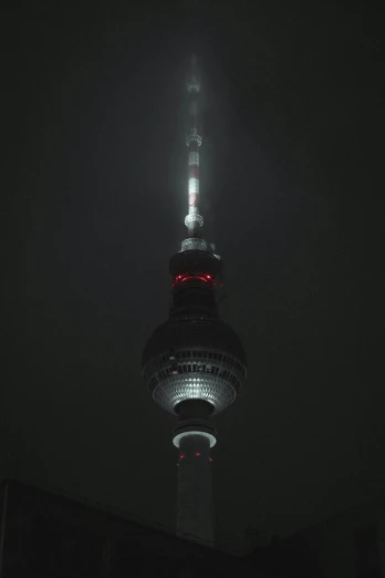 the view at night of the tv tower from across the street