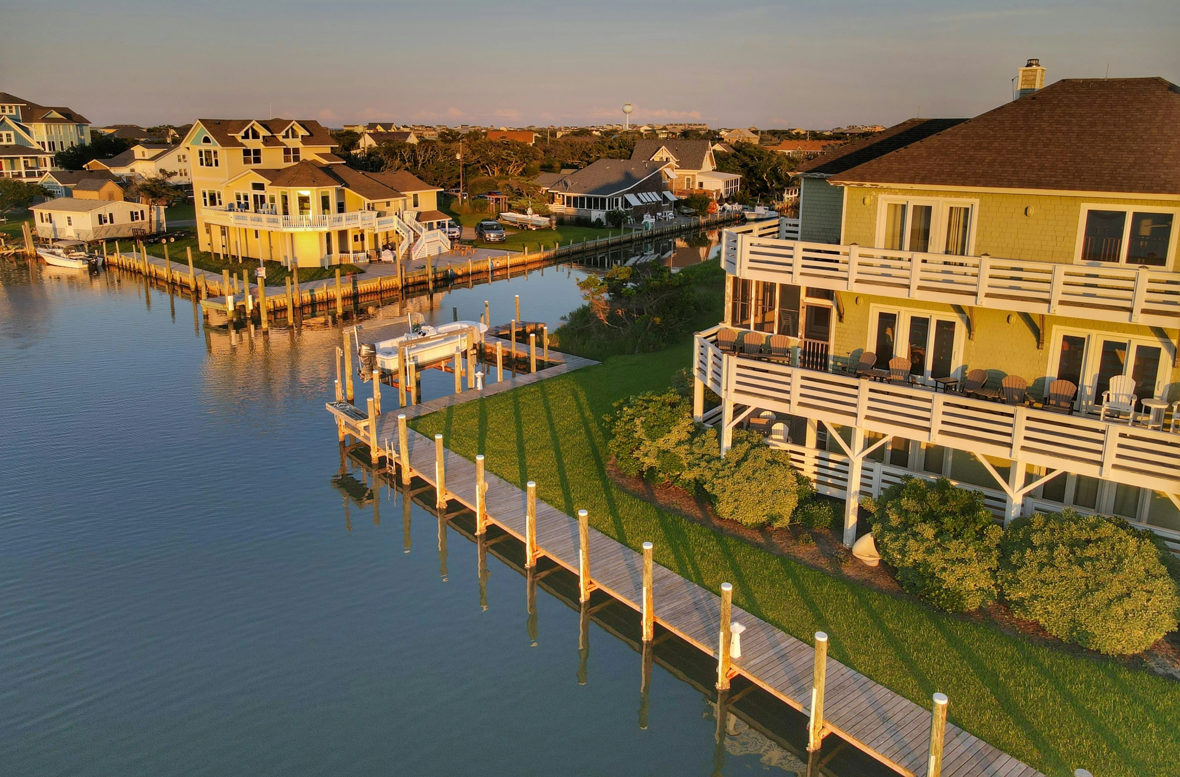 a view from the air of homes overlooking a body of water