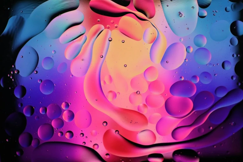 a colorful art work with bright colored drops