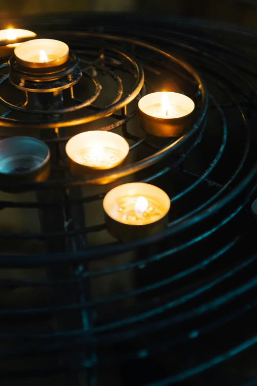 a close up image of an assortment of lit candles