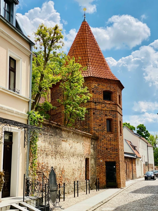 a tower with a clock sits on the side of the building