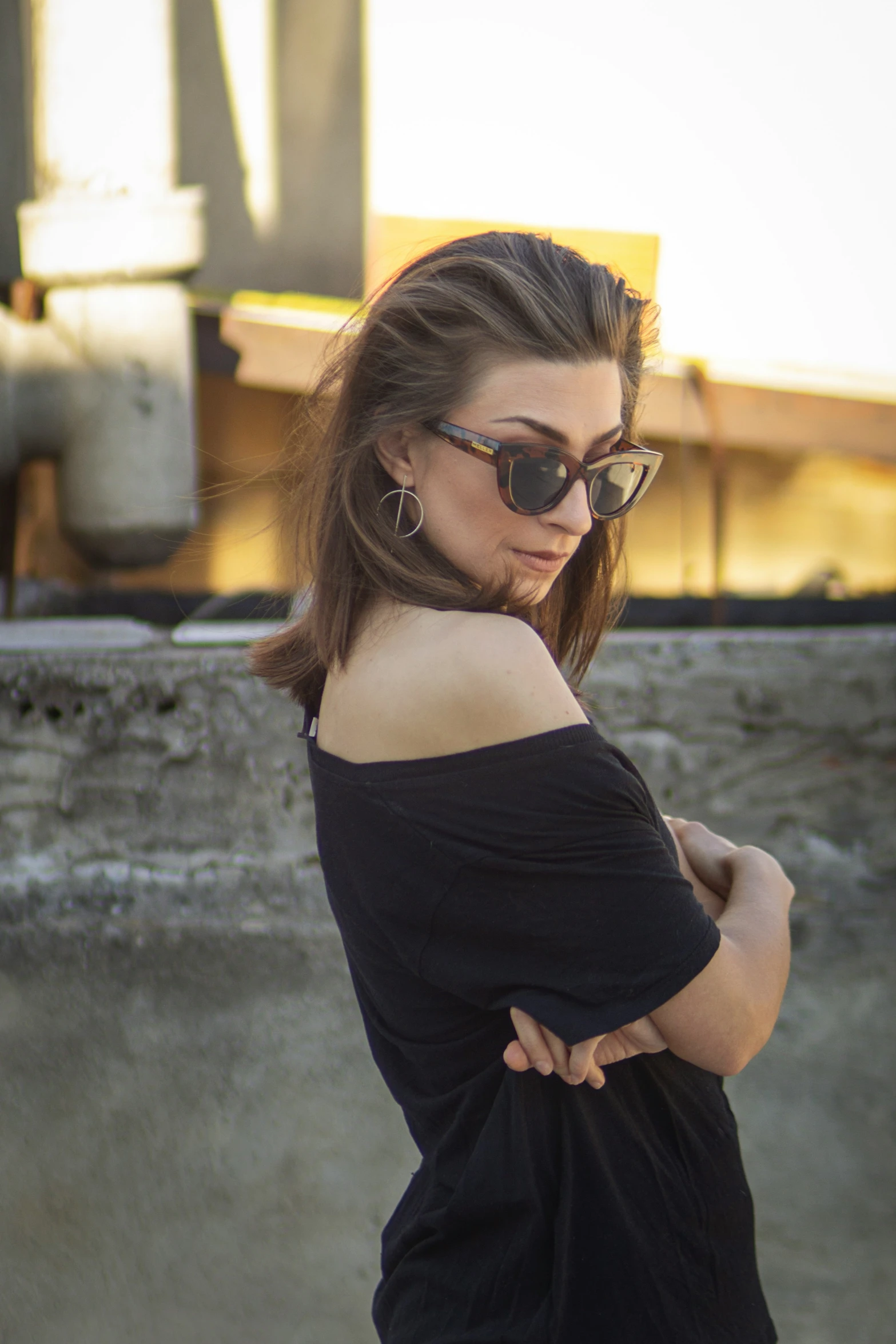 a woman in sunglasses on the side of a ramp