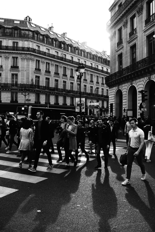 people crossing the street on a rainy day