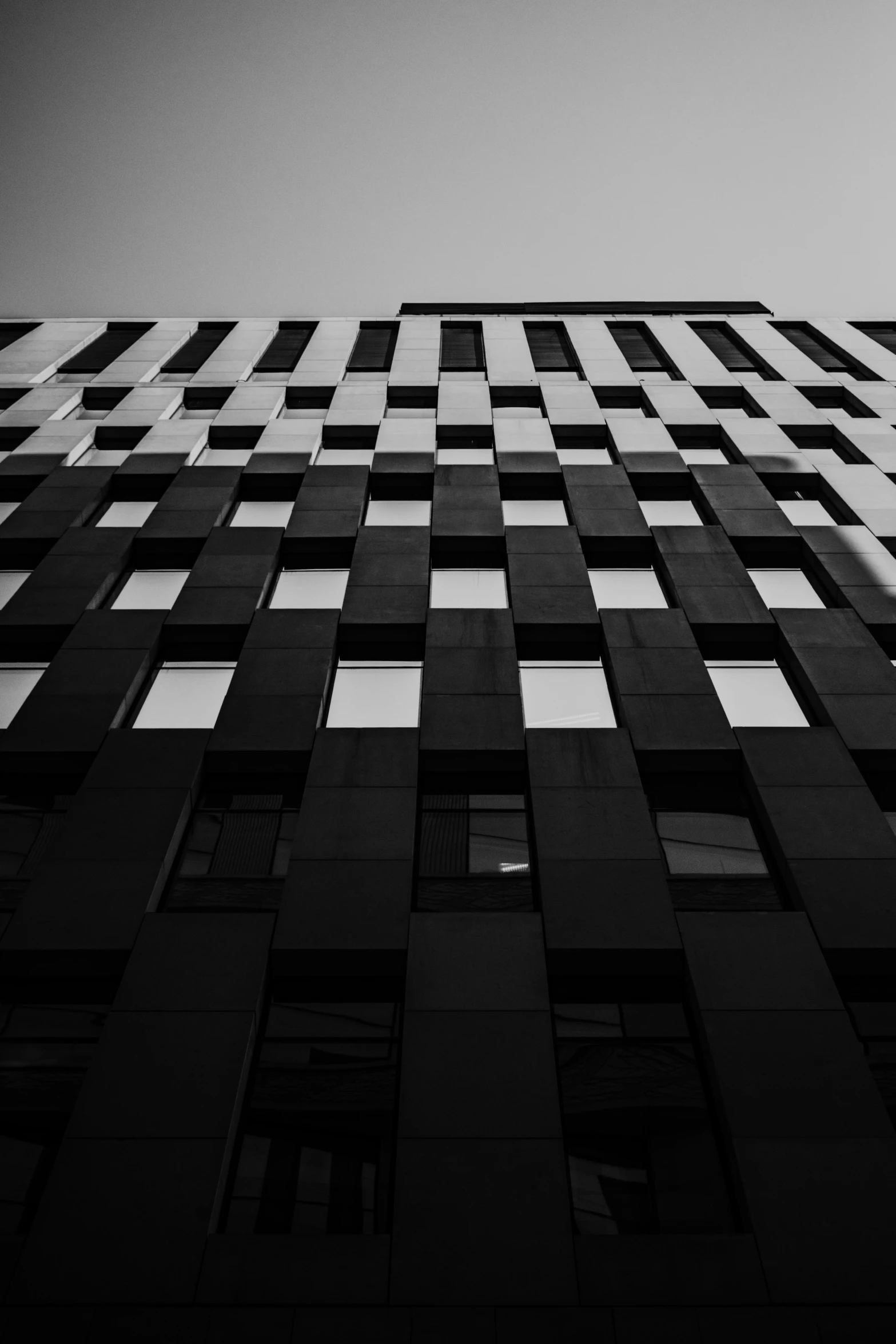 an architectural po of a very tall building with some windows