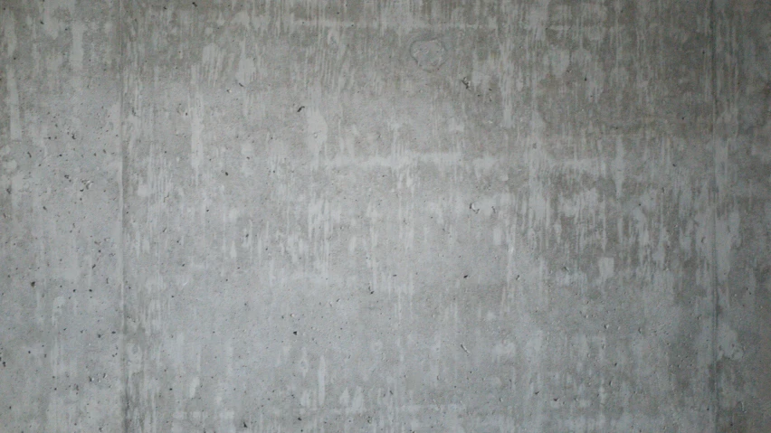 an empty wall has some type of concrete on it