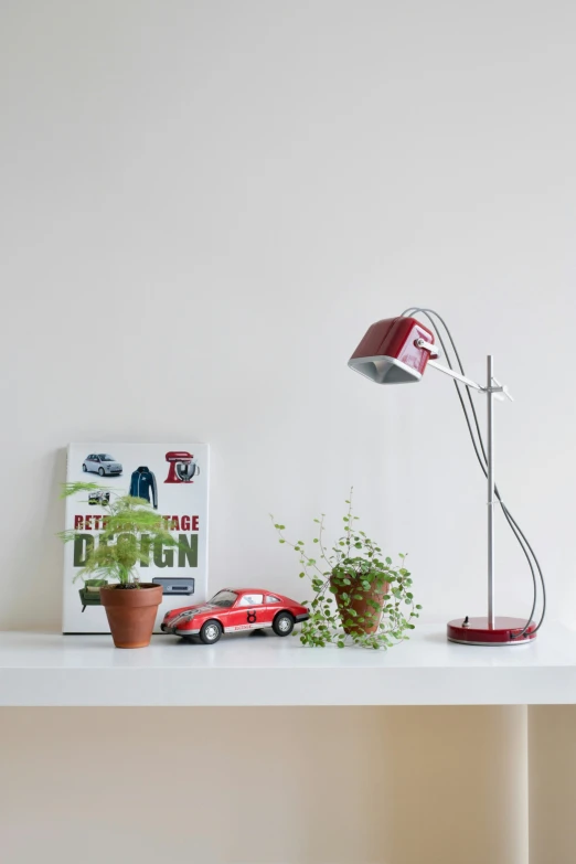 a long white shelf with various items on it