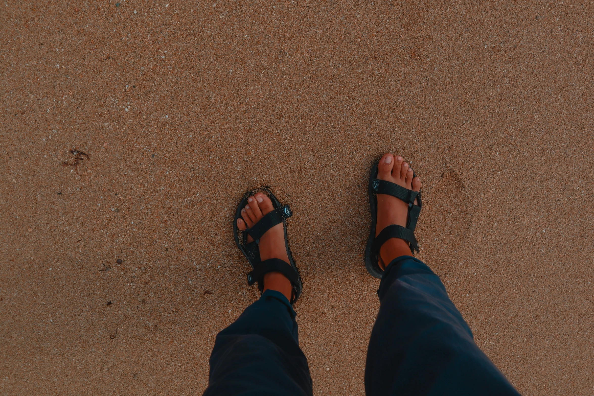 view from above looking down at a barefooted person's bare feet