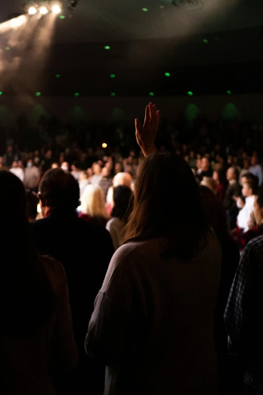 a crowd watching the concert from a stage