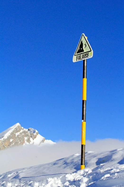 a street sign that has been vandalized on a pole