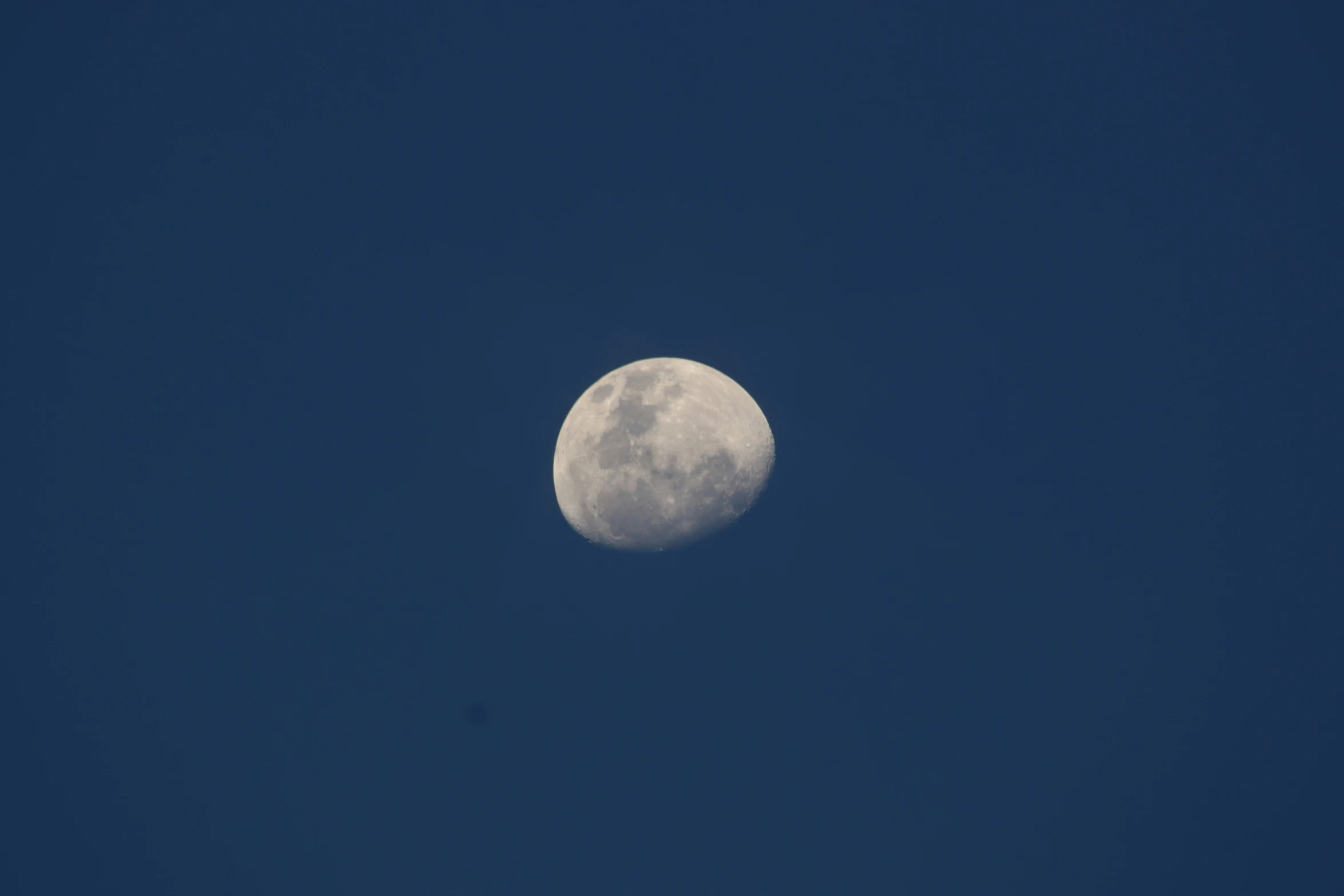 a po of the moon with the sky behind it