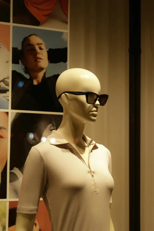 mannequin wearing glasses and sweater on display