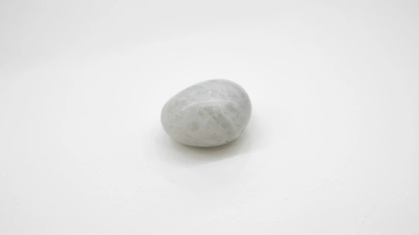 a large stone on a white surface, with no shadow