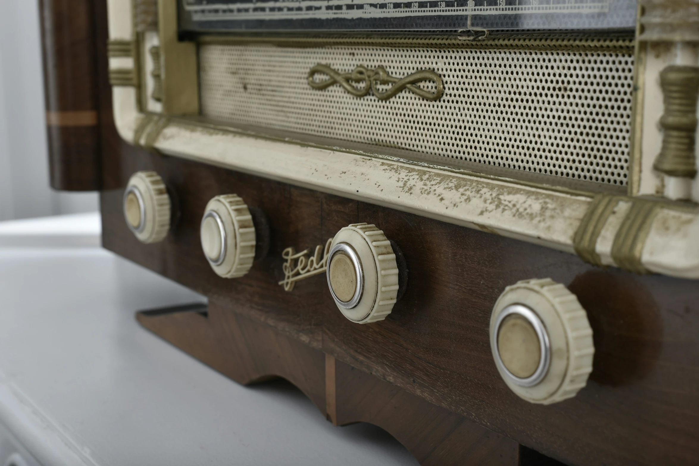 an old radio has three s on each side