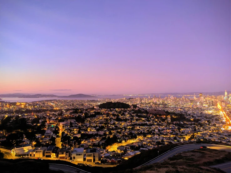 a view of a city from the top of a hill