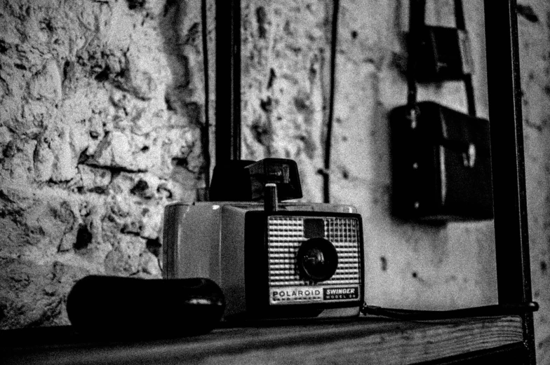 an old, stereo radio sitting next to a mirror in black and white