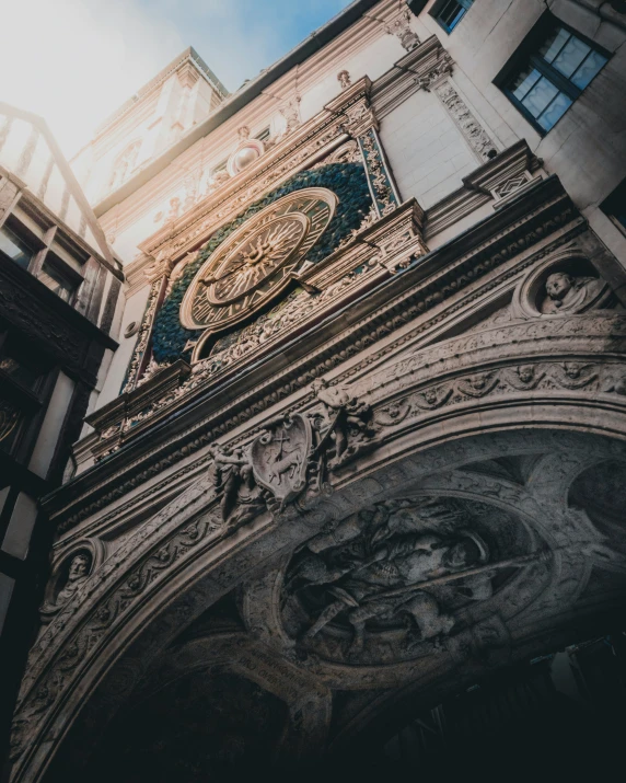 the back of an old building with a large clock