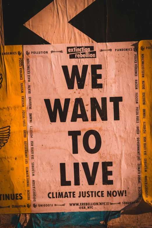 we want to live sign, with political slogan
