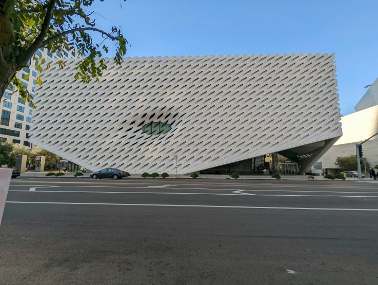 a white building that is next to a street