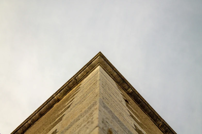 the corner of a building with a clock on it