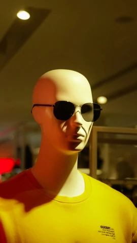 an image of a man wearing sunglasses looking back